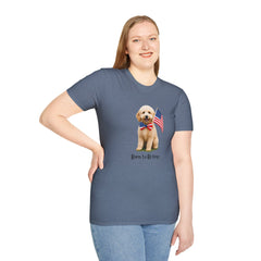 Female wearing T-shirt featuring a cute golden doodle puppy wearing an American flag bow tie and holding a small U.S. flag, with the phrase 'Born to Be Free' printed below the image.