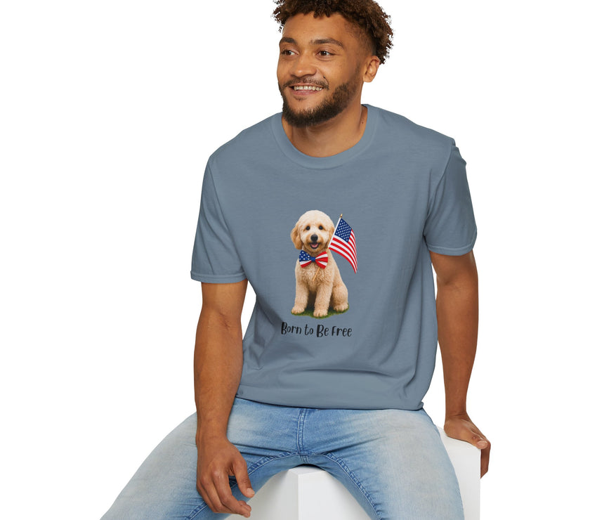 Male wearing T-shirt featuring a cute golden doodle puppy wearing an American flag bow tie and holding a small U.S. flag, with the phrase 'Born to Be Free' printed below the image.