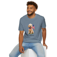 Male wearing T-shirt featuring a cute golden doodle puppy wearing an American flag bow tie and holding a small U.S. flag, with the phrase 'Born to Be Free' printed below the image.