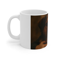 White mug with a black and brown abstract design on a white background
