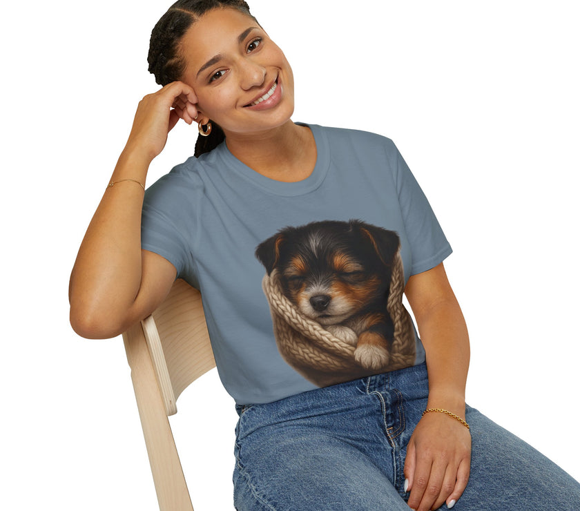 Person wearing a blue t-shirt with a puppy design, sitting on a white background