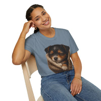 Person wearing a blue t-shirt with a puppy design, sitting on a white background