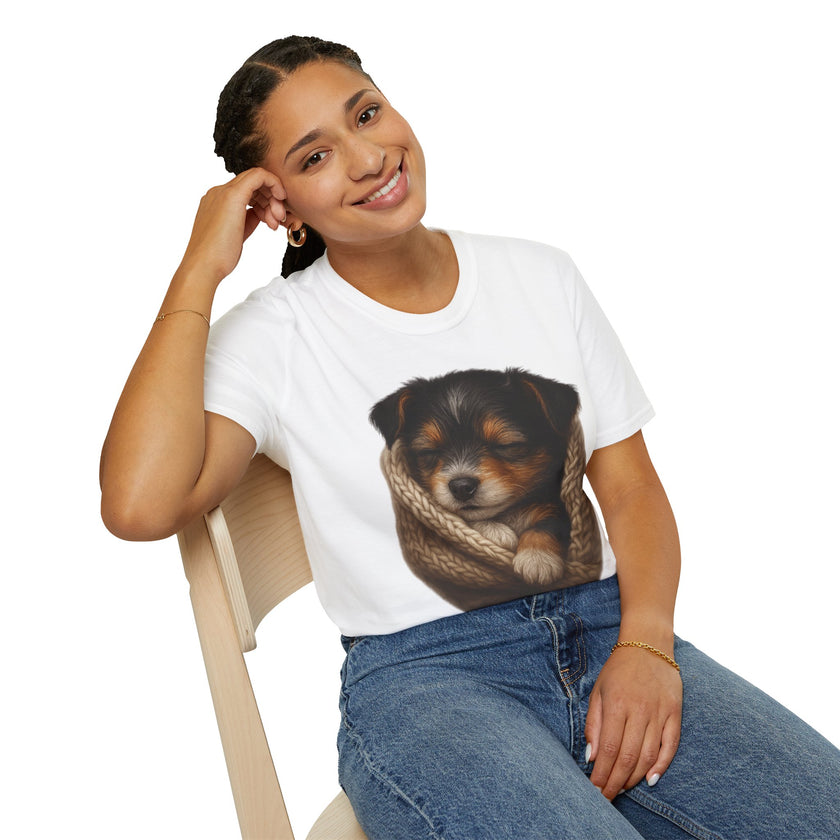 Person wearing a white t-shirt with a dog graphic, sitting on a chair against a white background
