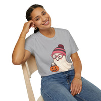Person wearing a gray t-shirt with a cartoon character design, sitting on a chair.