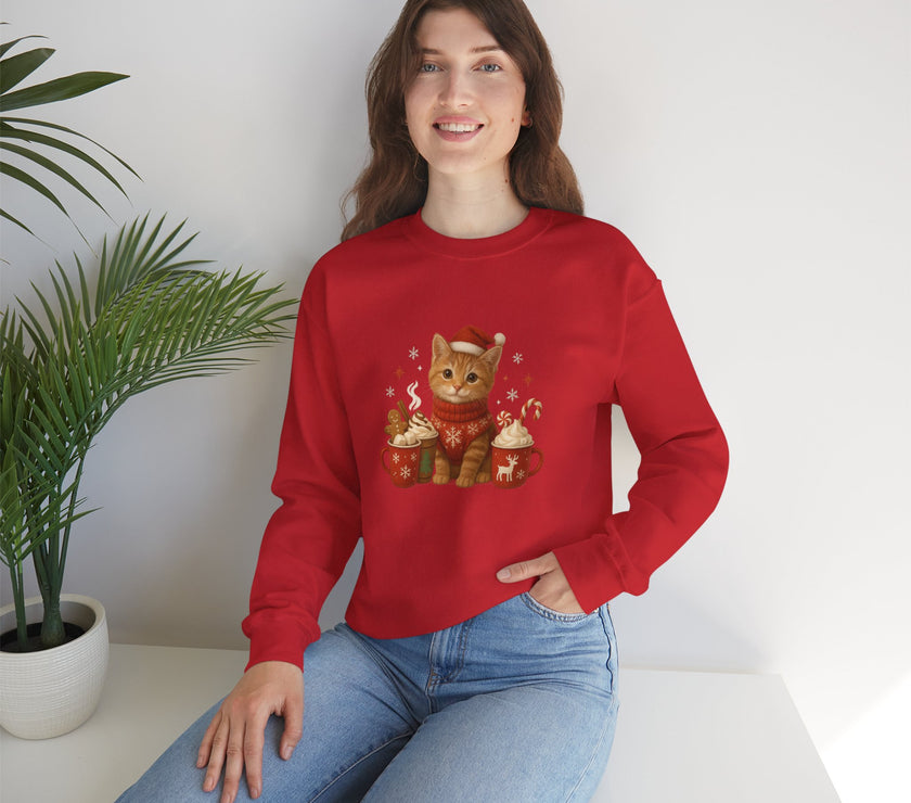 Person wearing a red sweater with a cat design, sitting on a white surface with a plant in the background.