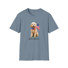 T-shirt featuring a cute golden doodle puppy wearing an American flag bow tie and holding a small U.S. flag, with the phrase 'Born to Be Free' printed below the image.