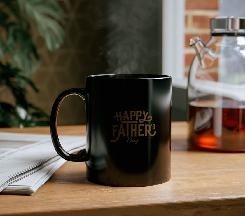 Black ceramic mug with gold Happy Father’s Day script, perfect gift for dads who enjoy stylish and meaningful coffee mugs