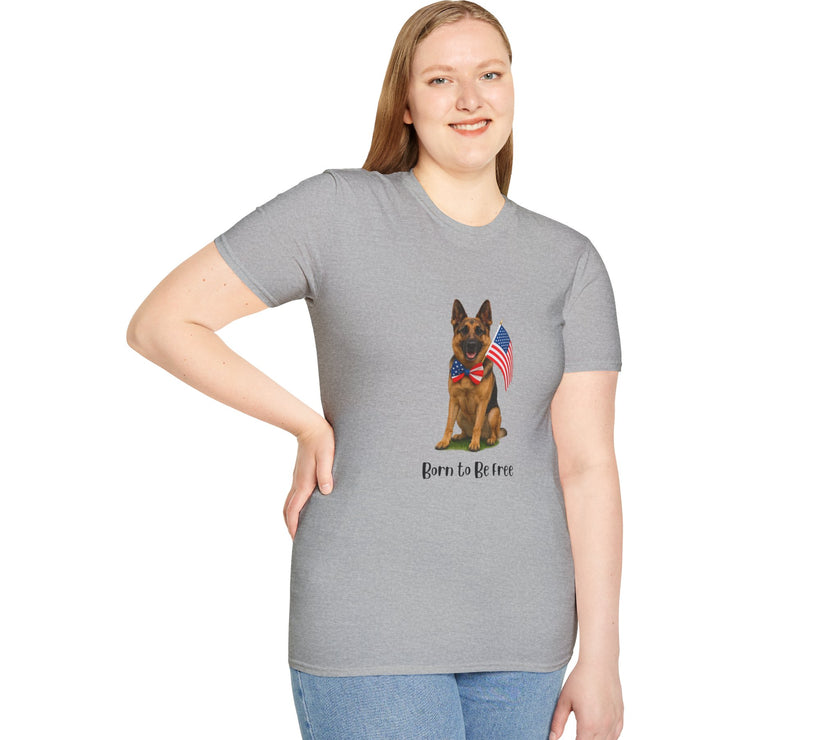 Sport Grey t-shirt featuring a patriotic German Shepherd wearing an American flag bowtie and holding U.S. flags, with the phrase "Born to Be Free" printed below — perfect for dog lovers and patriotic Americans.