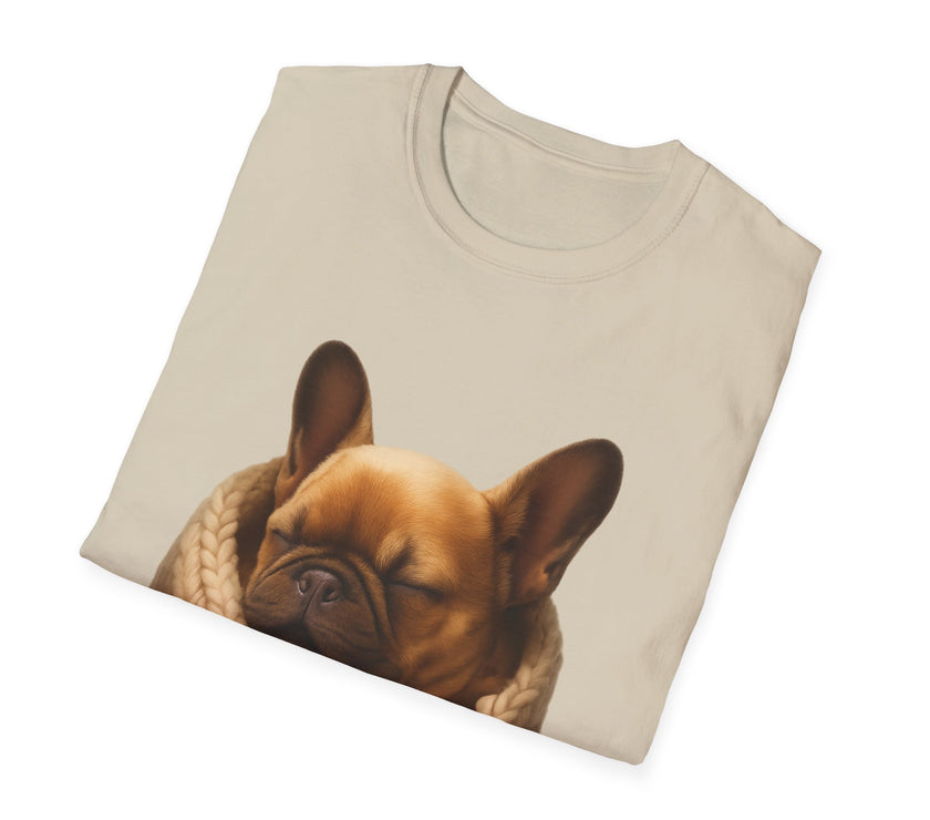 Folded beige t-shirt with a dog graphic on a white background