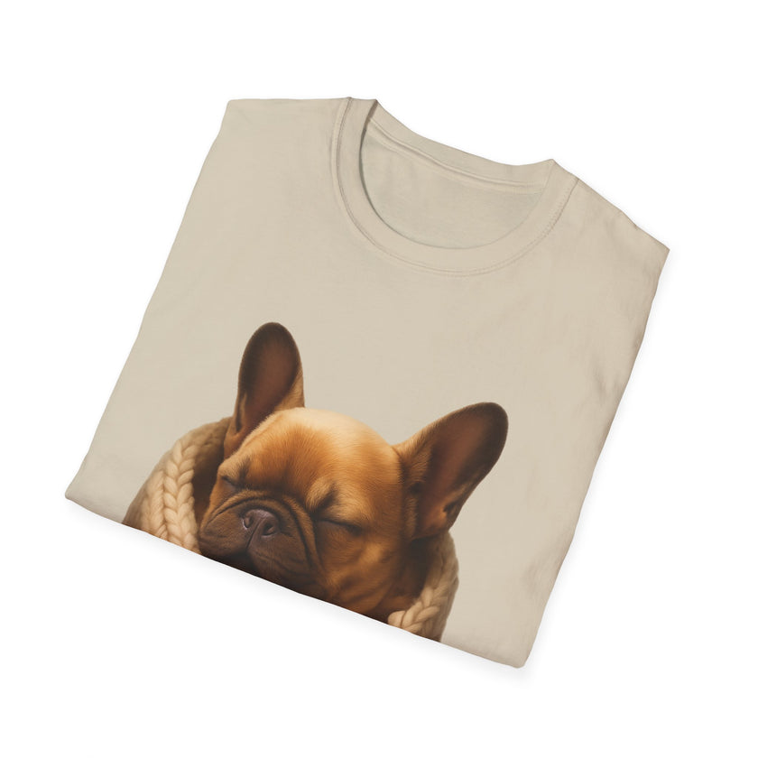 Folded beige t-shirt with a dog graphic on a white background