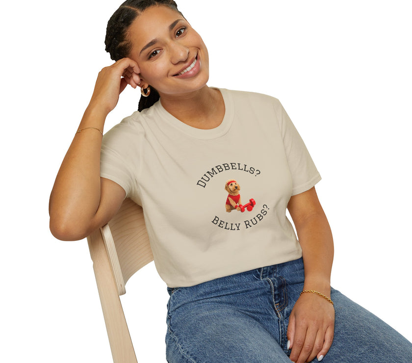 Person wearing a beige t-shirt with text and graphics, sitting on a chair.
