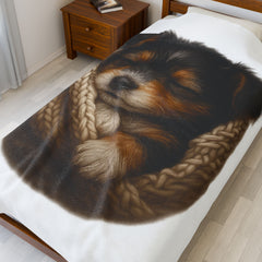 Blanket with Puppy wrapped in a knitted blanket on a white 