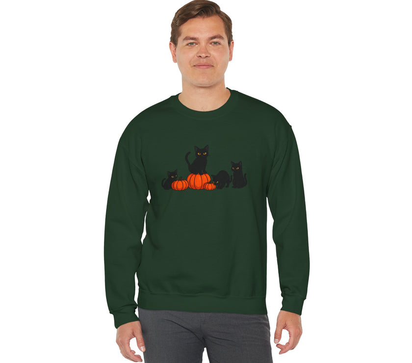 Man wearing a green sweatshirt with black cats and pumpkins design on a white background