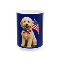 A ceramic mug featuring aGoldendoodle sitting on grass, wearing a red, white, and blue bow tie, and holding an American flag against a dark blue background. with the message "Born to be Free"