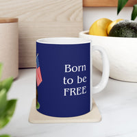 A ceramic mug featuring a Rottweiler sitting on grass, wearing a red, white, and blue bow tie, and holding an American flag against a dark blue background. with the message "Born to be Free"
