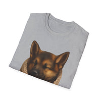 Folded gray t-shirt with a dog's face printed on it against a white background