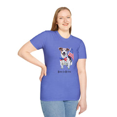 Female wearing T-shirt featuring a cute  puppy wearing an American flag bow tie and holding a small U.S. flag, with the phrase 'Born to Be Free' printed below the image.