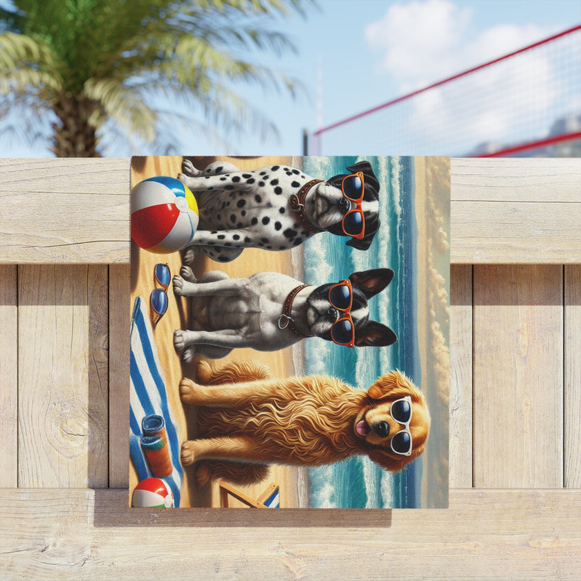Colorful beach towel featuring four stylish dogs wearing sunglasses, sitting on a sandy beach with beach chairs, beach balls, and ocean waves in the background under a bright sky.