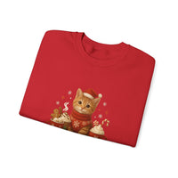 Folded red sweater with a Christmas-themed cat design on a white background