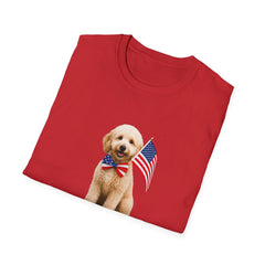Folded T-shirt featuring a cute golden doodle puppy wearing an American flag bow tie and holding a small U.S. flag, with the phrase 'Born to Be Free' printed below the image.