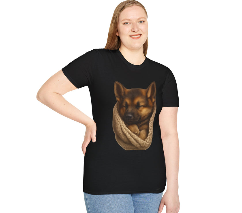 Person wearing a black t-shirt with a graphic of a dog in a sling on a white background