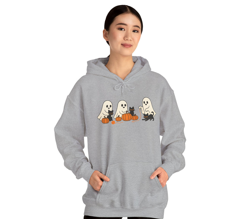 Person wearing a gray hoodie with Halloween-themed design on a white background