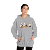 Person wearing a gray hoodie with Halloween-themed design on a white background