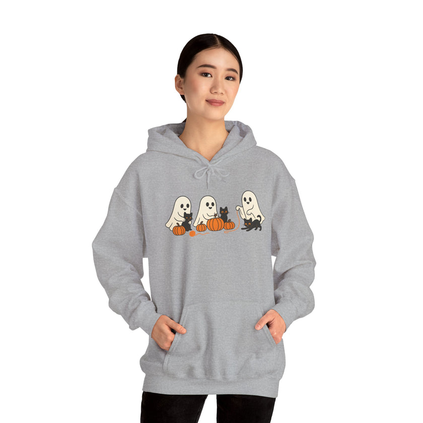 Person wearing a gray hoodie with Halloween-themed design on a white background