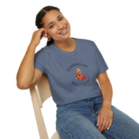 Person wearing a blue t-shirt with a graphic and text, sitting on a chair against a white background
