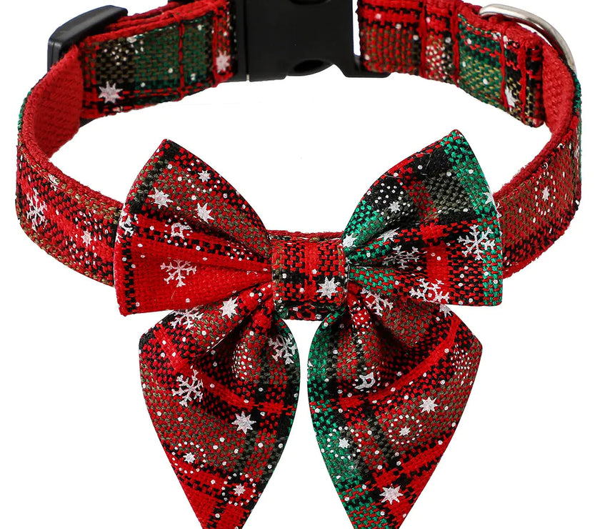 Red and green plaid dog collar with a large bow on a white background