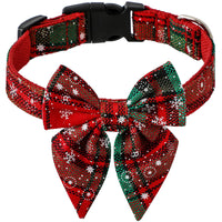 Red and green plaid dog collar with a large bow on a white background