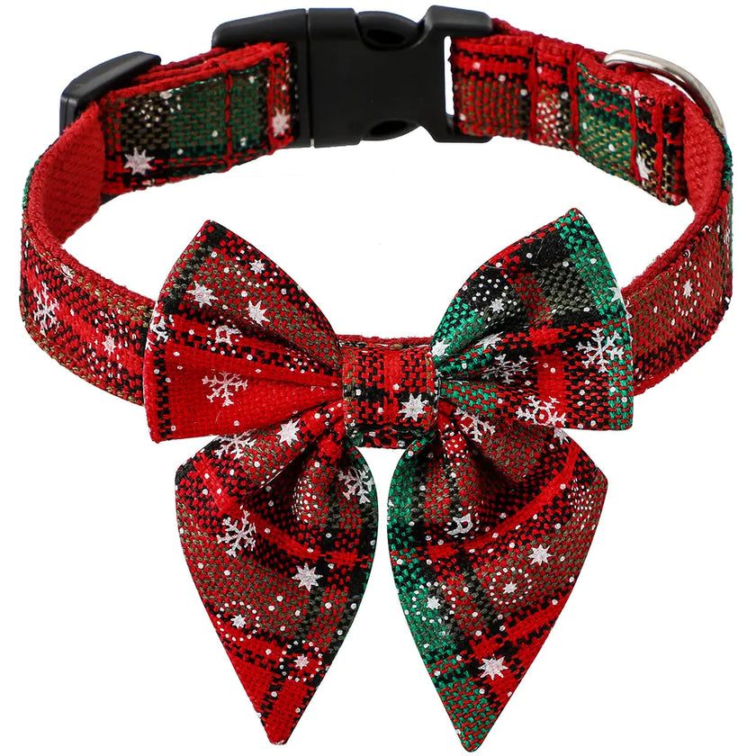 Red and green plaid dog collar with a large bow on a white background