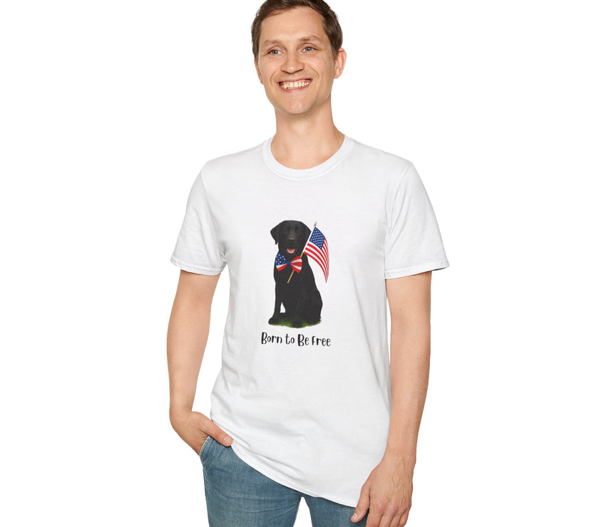 White t-shirt featuring a patriotic Black Lab wearing an American flag bowtie and holding U.S. flags, with the Black Labphrase "Born to Be Free" printed below — perfect for dog lovers and patriotic Americans.