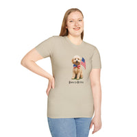 Female wearing T-shirt featuring a cute golden doodle puppy wearing an American flag bow tie and holding a small U.S. flag, with the phrase 'Born to Be Free' printed below the image.