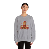 Gray sweatshirt with a cat design featuring hot chocolate and cookies, worn by a model on a white background.