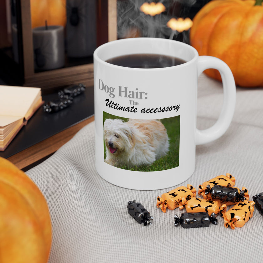 White ceramic mug featuring a photo of dogs lying on grass, with the humorous quote "Dog Hair: The Ultimate Accessory" printed below the image.