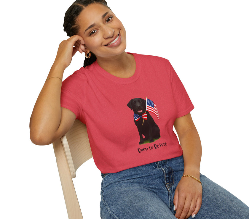 Heather Red  t-shirt featuring a patriotic Black Lab wearing an American flag bowtie and holding U.S. flags, with the Black Lab phrase "Born to Be Free" printed below — perfect for dog lovers and patriotic Americans.