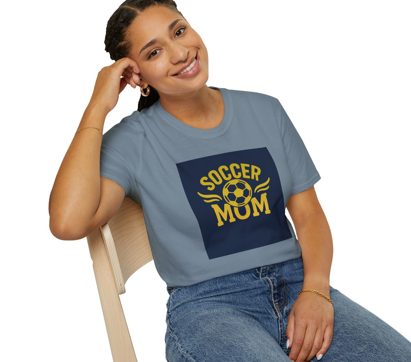 Woman wearing a blue t-shirt with 'Soccer Mum' text and design, sitting on a chair.