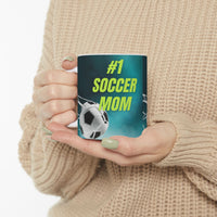 Mug with '#1 Soccer Mom' text and soccer ball design on a teal background