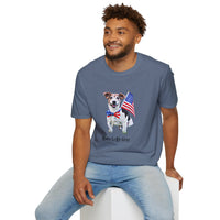 Male wearing T-shirt featuring a cute golden doodle puppy wearing an American flag bow tie and holding a small U.S. flag, with the phrase 'Born to Be Free' printed below the image.