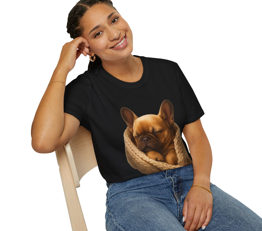 Person wearing a black t-shirt with a dog graphic, sitting on a chair.