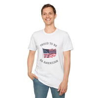 Young man  wearing a white t-shirt with an American flag graphic and the words 'Proud to Be an American' printed around the flag