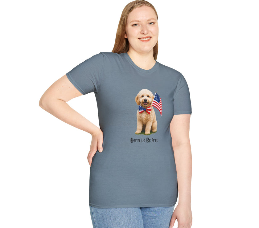 Female wearing T-shirt featuring a cute golden doodle puppy wearing an American flag bow tie and holding a small U.S. flag, with the phrase 'Born to Be Free' printed below the image.