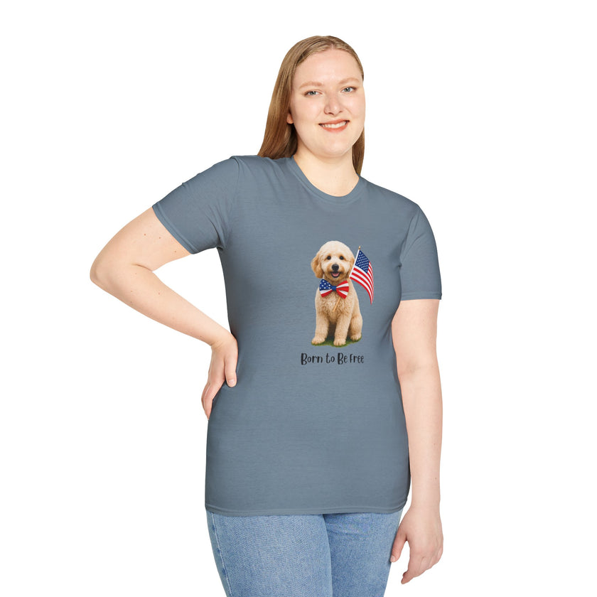 Female wearing T-shirt featuring a cute golden doodle puppy wearing an American flag bow tie and holding a small U.S. flag, with the phrase 'Born to Be Free' printed below the image.