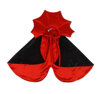 Red and black cape with a large bow on a white background