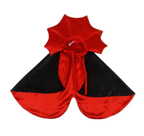 Red and black cape with a large bow on a white background