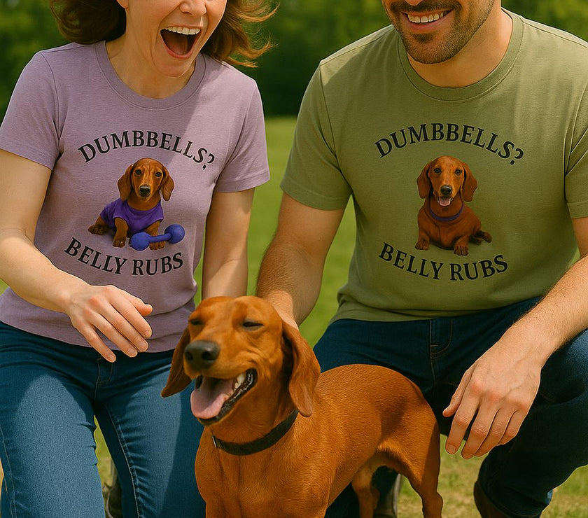 Female and male with their dog wearing adult T-shirt with a printed image of a dog and the humorous text 'Dumbbells? Belly Rubs?', designed for dog lovers and fitness enthusiasts.le with a dog