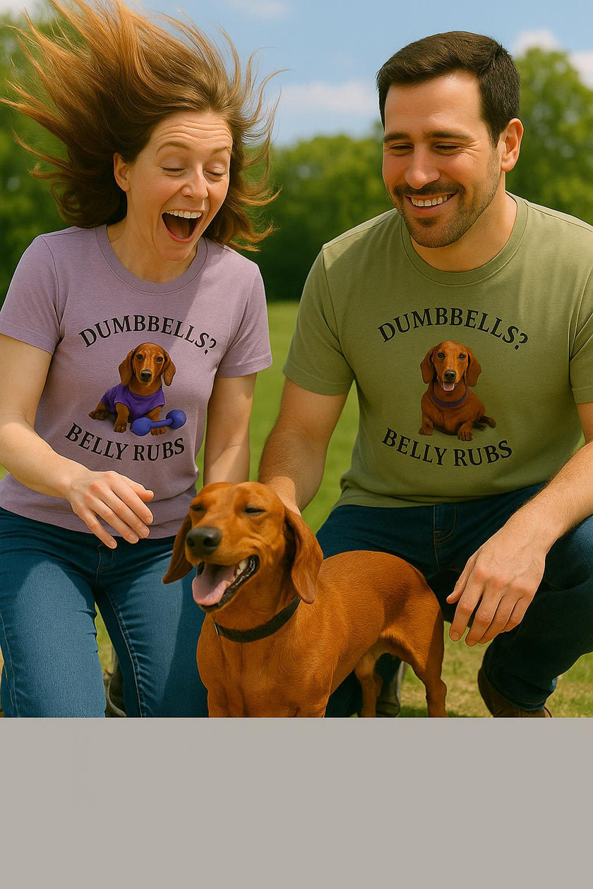 Female and male with their dog wearing adult T-shirt with a printed image of a dog and the humorous text 'Dumbbells? Belly Rubs?', designed for dog lovers and fitness enthusiasts.le with a dog