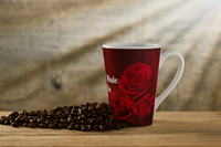 Steaming cup of coffee in rose overed mug with message "Mama Bear Mode - Aways On"