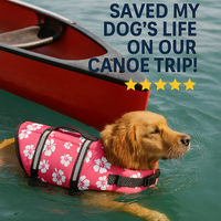 dog wearing red flral print life vest swimming next to a canoe